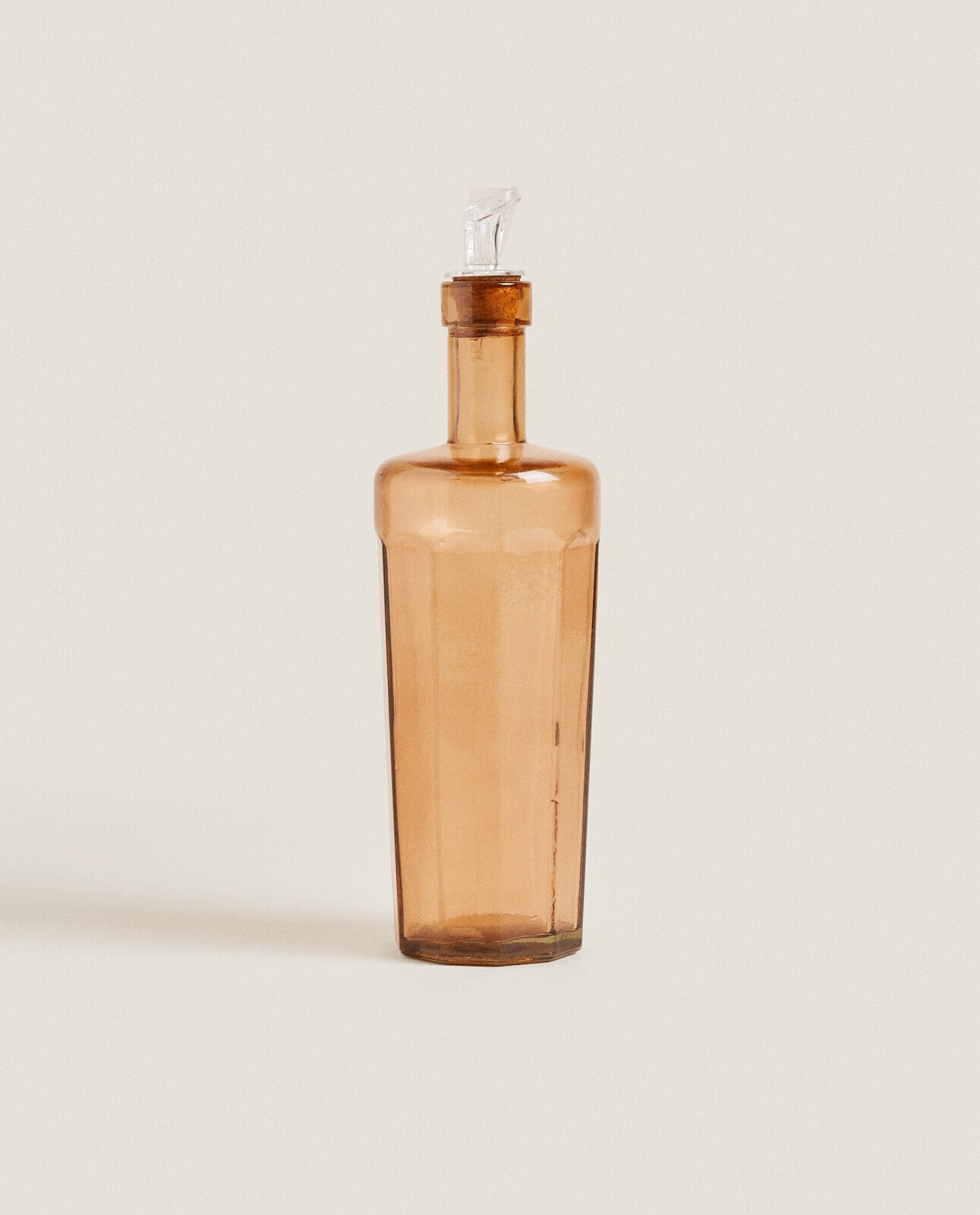 Faceted glass cruet with cork