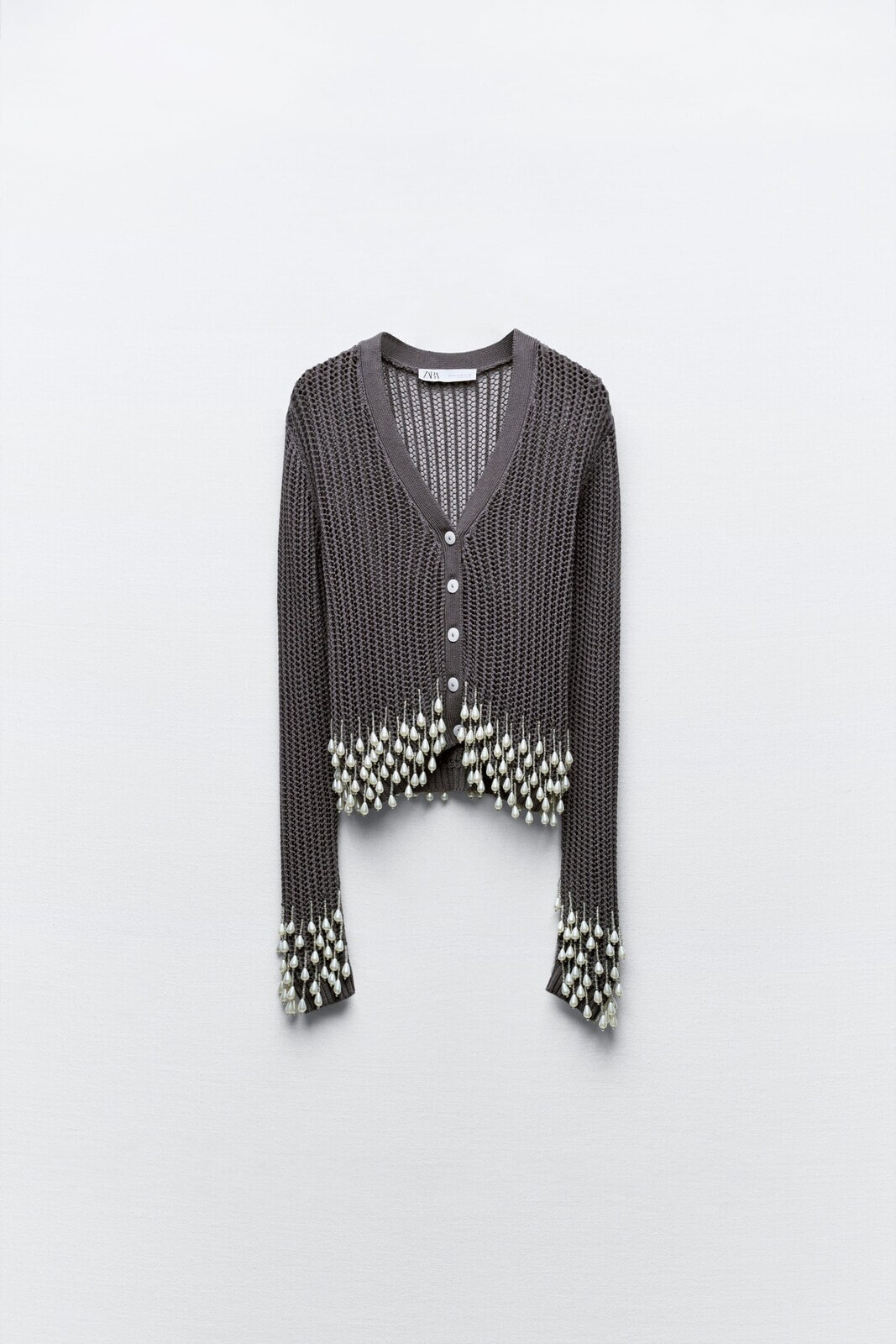 Knit cardigan with fringing and faux pearl beads