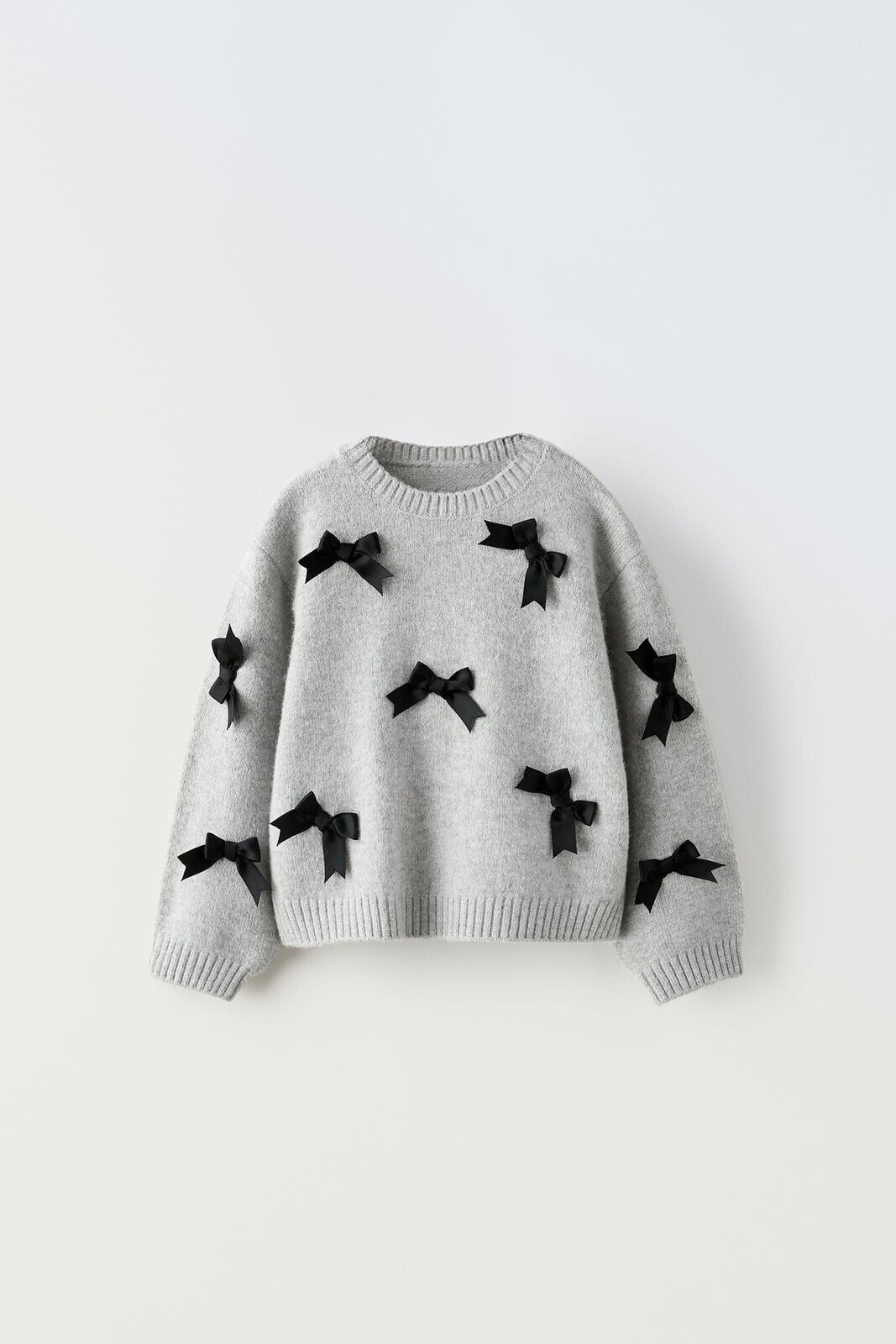 Knit sweater with bows