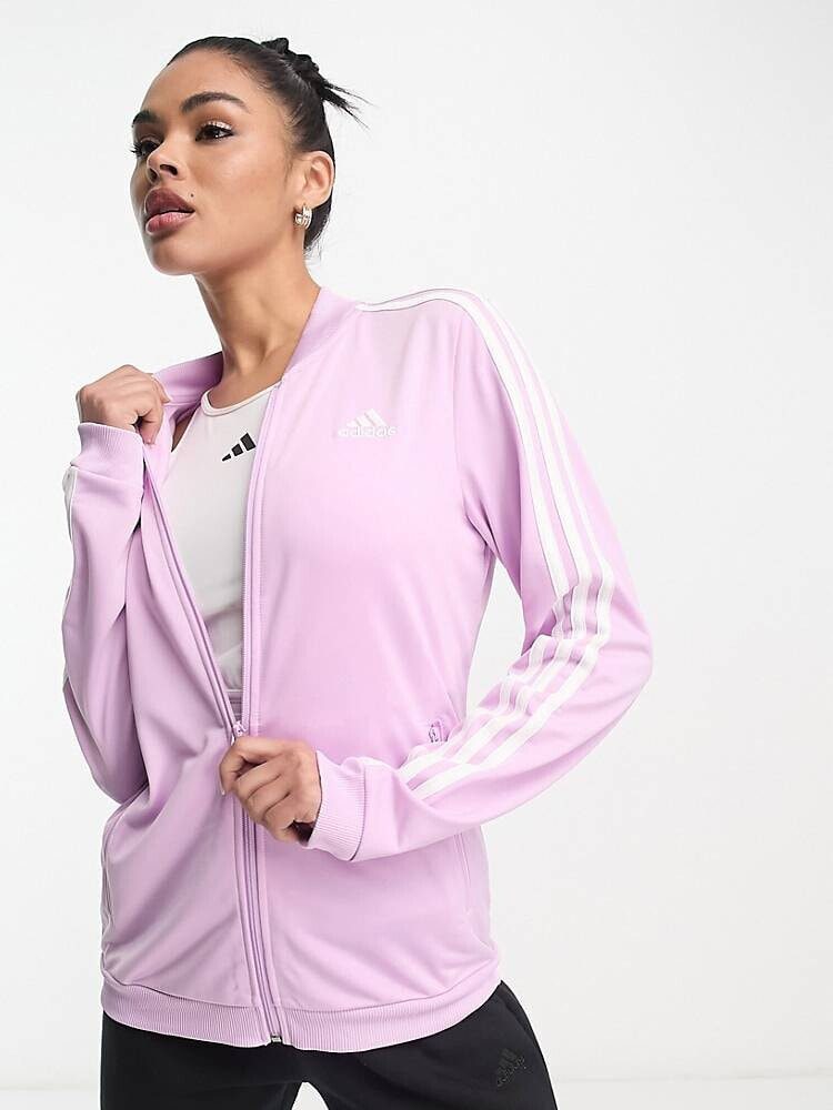 adidas – Sportswear – Essential – Trainingsanzug in Rosa mit 3 Streifen