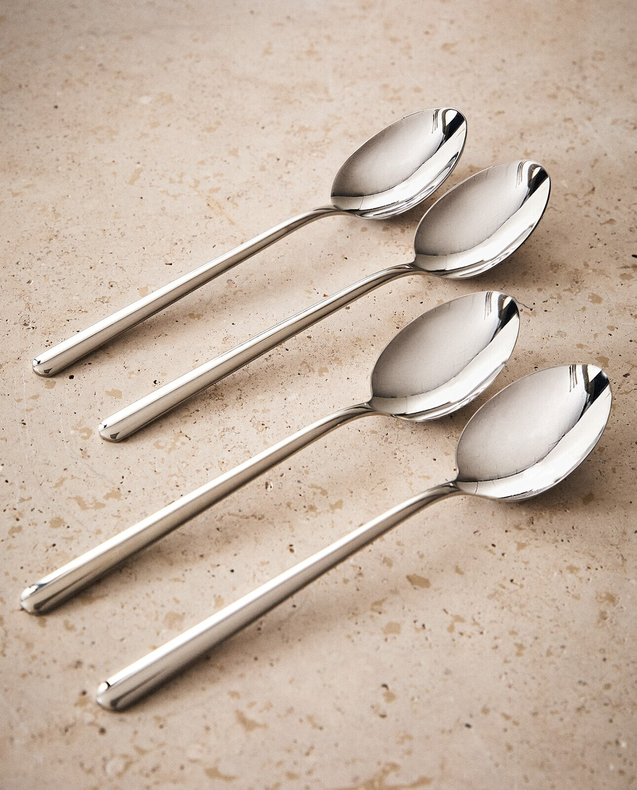 Set of shiny steel spoons