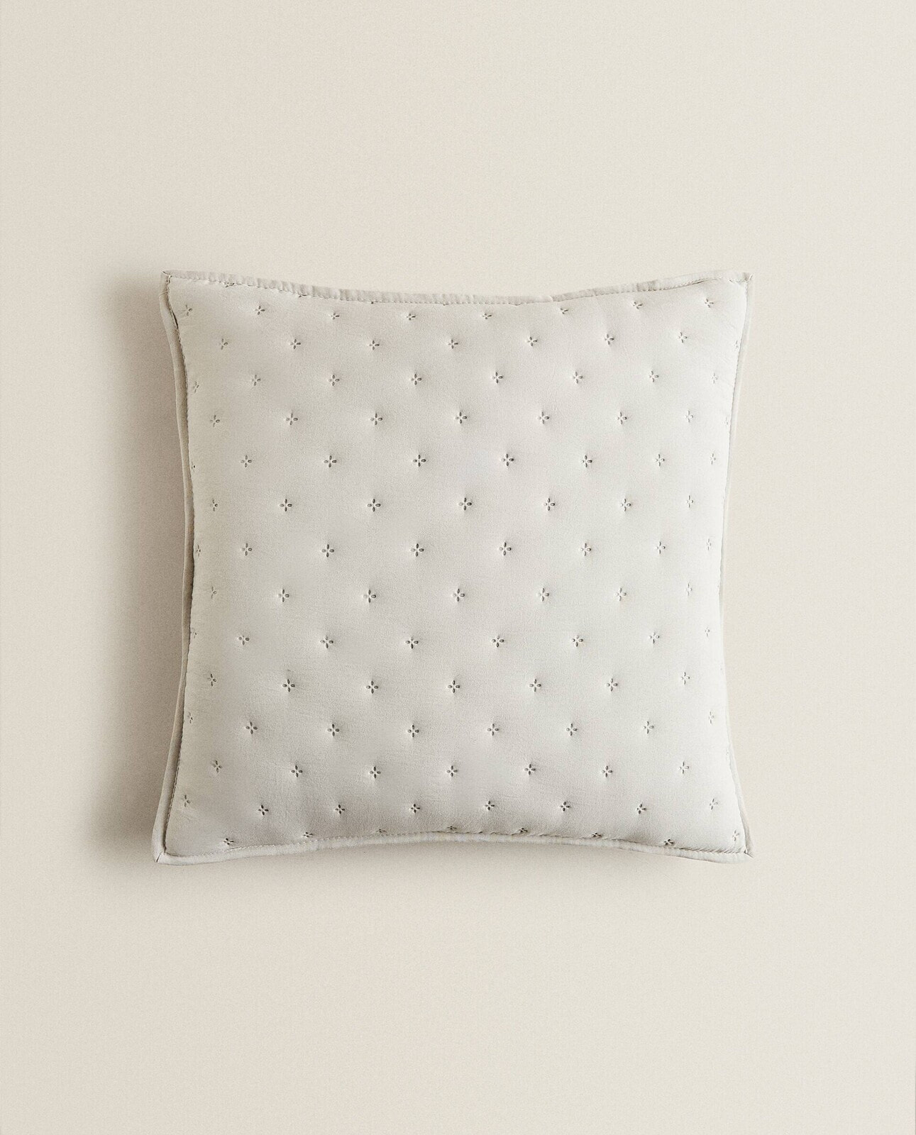 Quilted dotted cushion cover