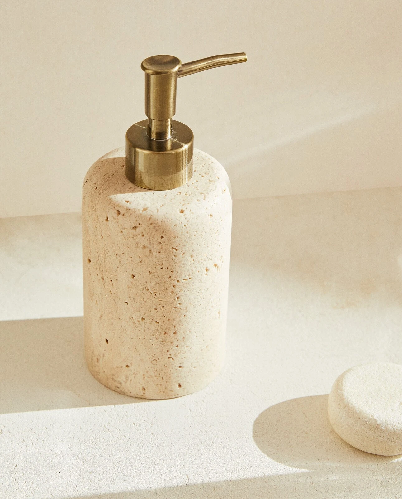 Beige marble bathroom dispenser