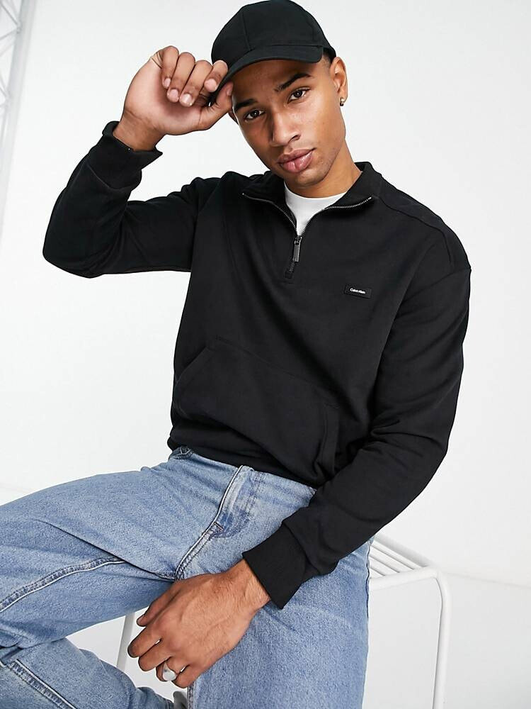 Calvin Klein – Komfortables Sweatshirt aus Baumwollmix in Schwarz mit halbem Reißverschluss und Kultlogo