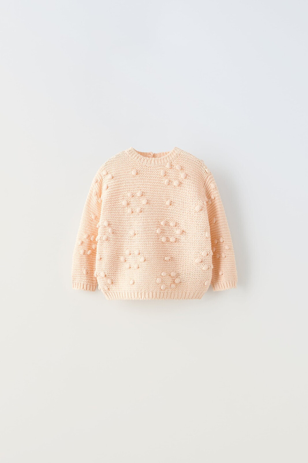 Knit sweater with beaded detail