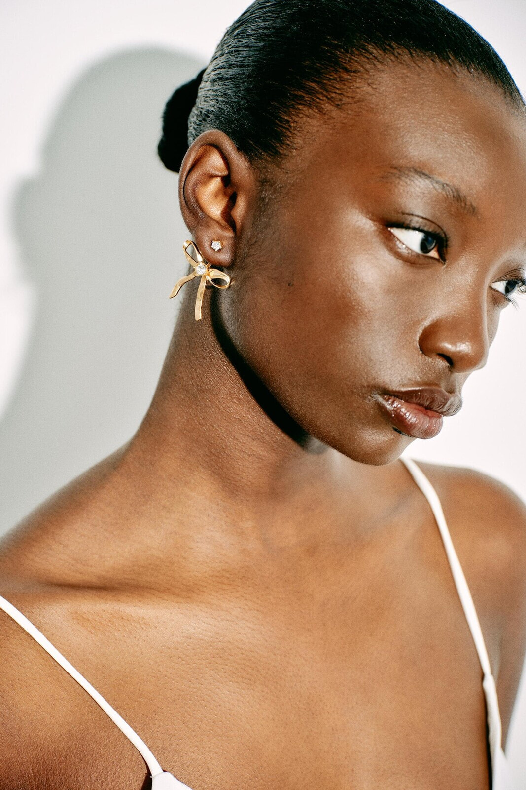 Metal bow earrings with rhinestones