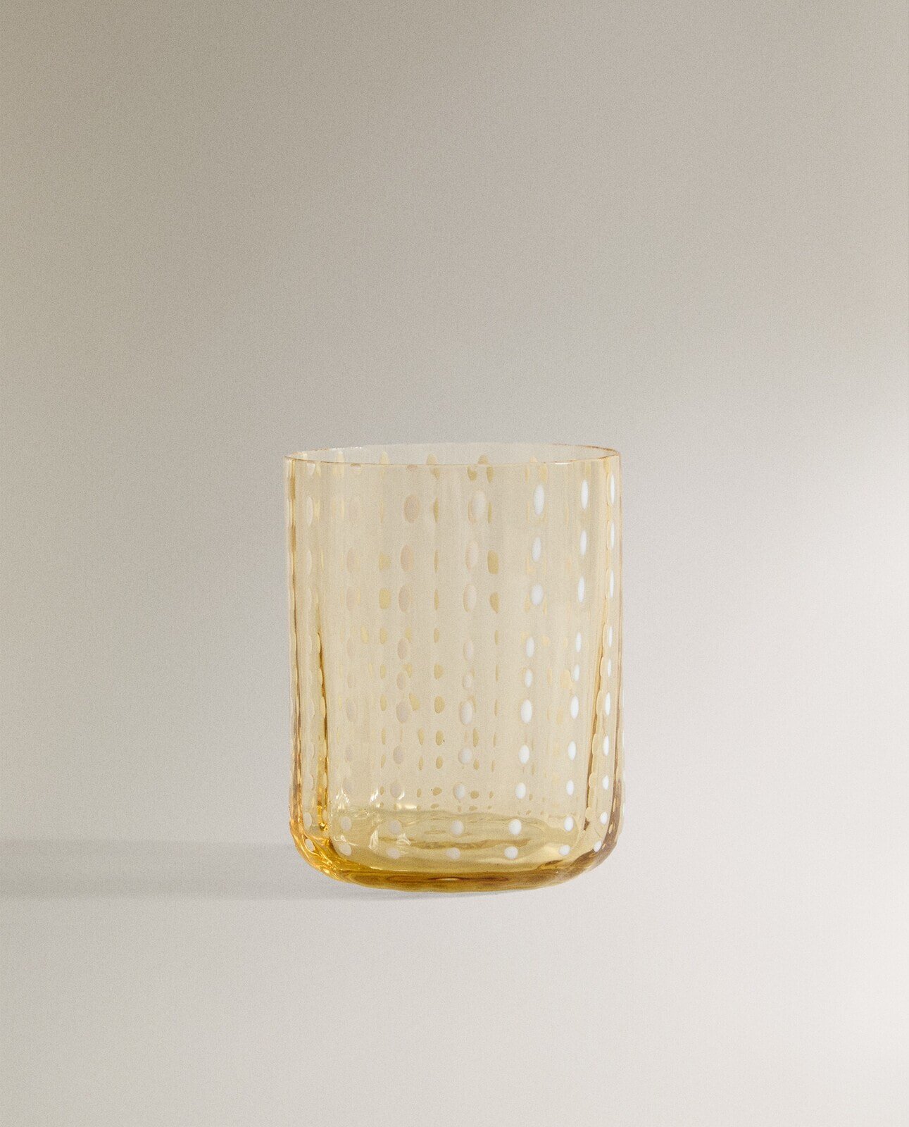 Dotted glass tumbler