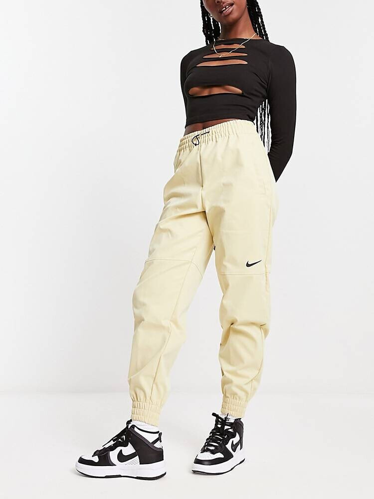 Buy Nike Swoosh Woven Pants White in UAE