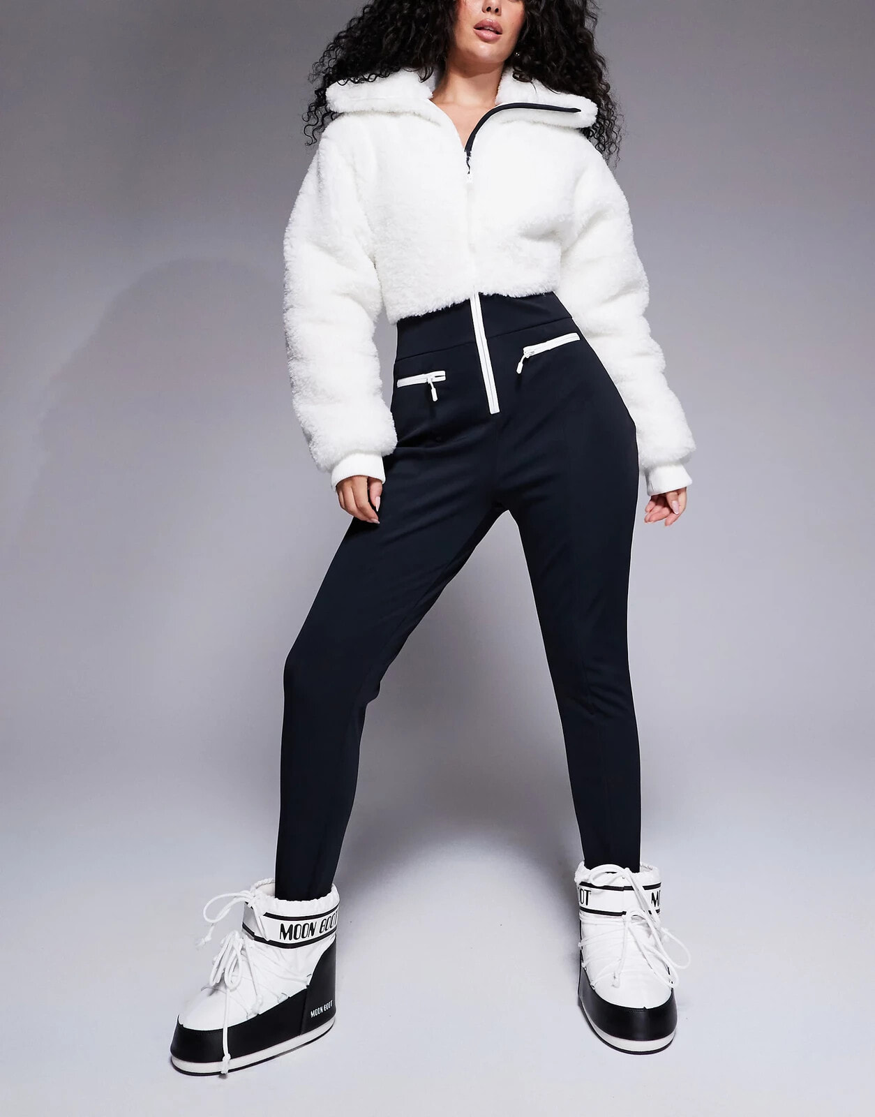 ASOS 4505 Hourglass Ski suit with faux fur panels and skinny leg in black and white