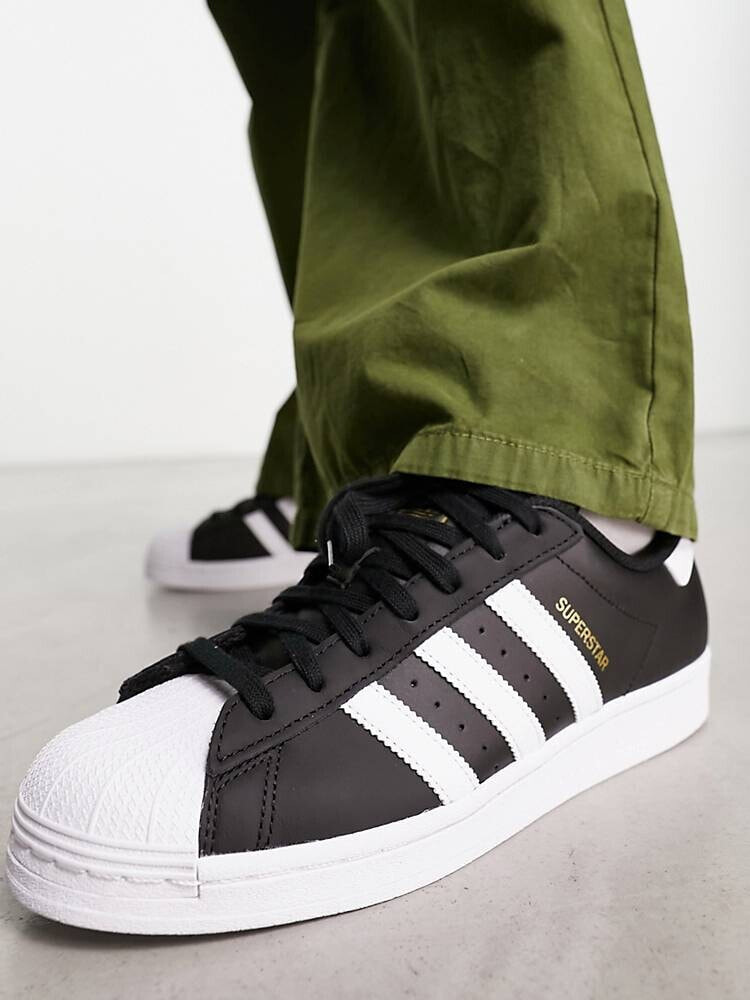 Adidas superstar black hot sale stripe