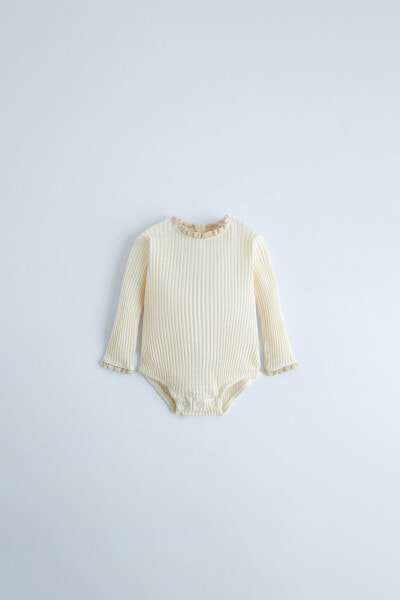 Ribbed bodysuit with lace trim