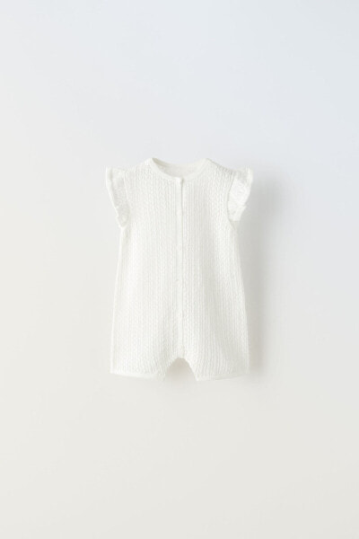 Short textured dungarees with ruffles