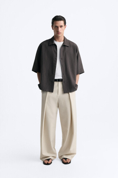 WIDE-FIT PLEATED TROUSERS