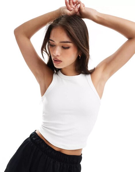 Nike Training One fitted cropped tank top in white