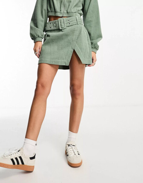 ASOS DESIGN cord wrap mini skirt in sage co-ord