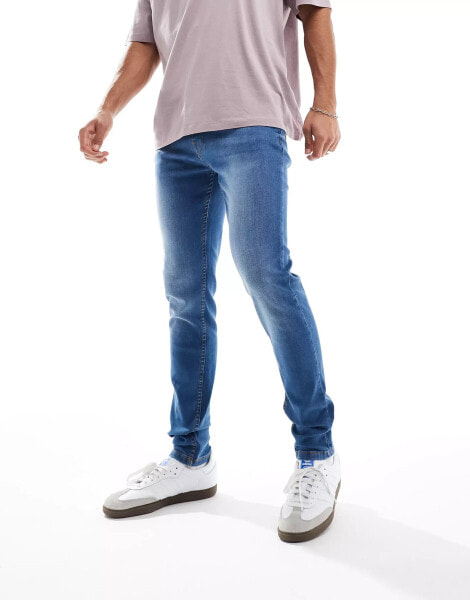 DTT – Stretch-Jeans mit sehr engem Schnitt in Mittelblau