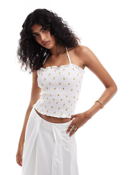 ASOS DESIGN shirred halter top with lemon ditsy print in white