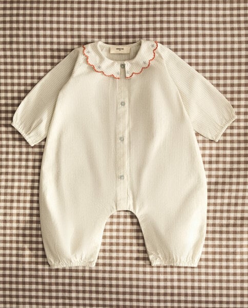 Children’s romper with embroidered floral collar