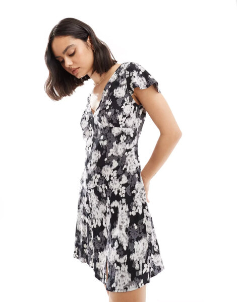 ASOS DESIGN v neck flutter sleeve mini tea dress in mono blurred floral print