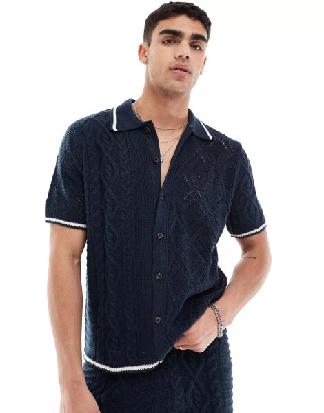 ASOS DESIGN co-ord knitted spliced cable and pointelle stitch button through polo with tipping in navy