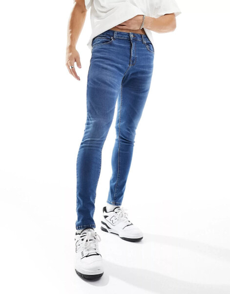 ASOS DESIGN spray on jeans with power stretch in dark vintage tint