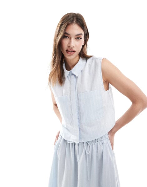 ASOS DESIGN sleeveless cropped shirt in blue and white stripe