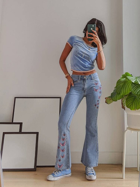 Labelrail x Pose and Repeat mid rise 90s flared jeans with butterfly appliques in blue