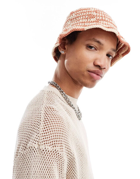 ASOS DESIGN crochet bucket hat with stripe in orange and ecru