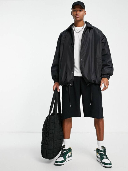 ASOS DESIGN extreme oversized shower resistant rain jacket in black
