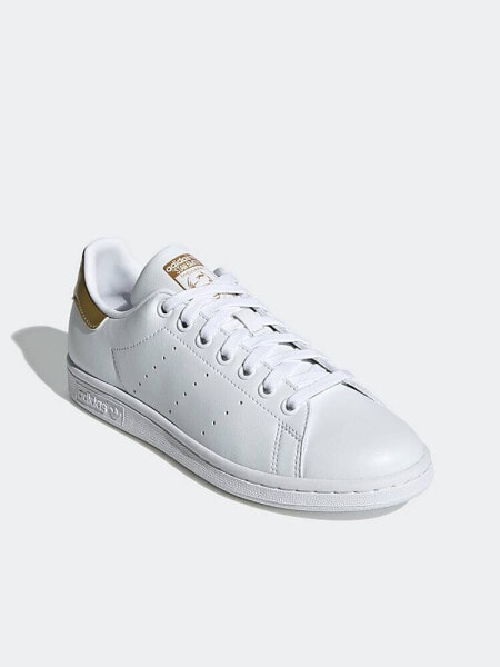 adidas Originals Stan Smith trainers in white/gold