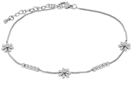 Delicate steel chain on the leg with flowers