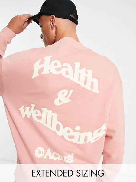 ASOS Actual oversized sweatshirt with health and wellbeing logo back print in pink