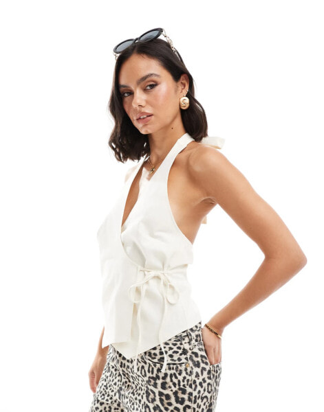 ASOS DESIGN wrap front halter waistcoat in cream