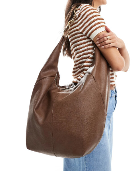 ASOS DESIGN oversized washed tote bag with hardware detail in tan