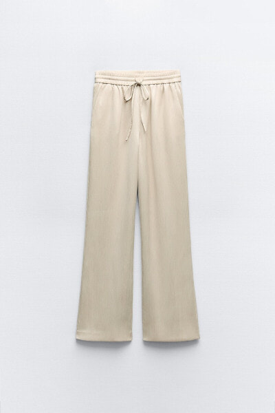 Creased-effect trousers