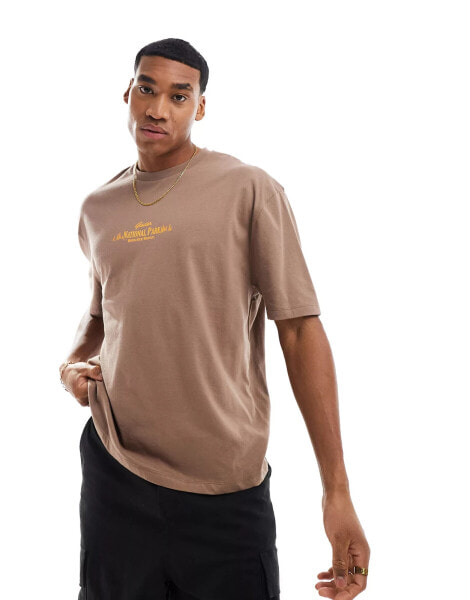 ASOS DESIGN oversized t-shirt in brown with text chest print