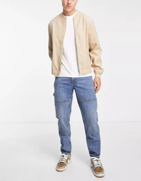 ASOS DESIGN — Schmal zulaufende Carpenter-Jeans in hellblauer Waschung