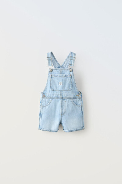 Short dungarees with buckles and label