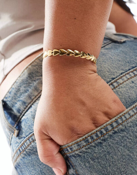 ASOS DESIGN Curve waterproof stainless steel cuff bracelet with heart detail in gold tone