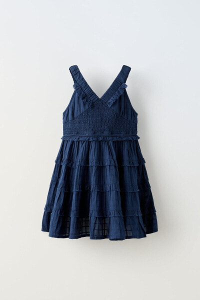 Ruffled dress with elasticated details
