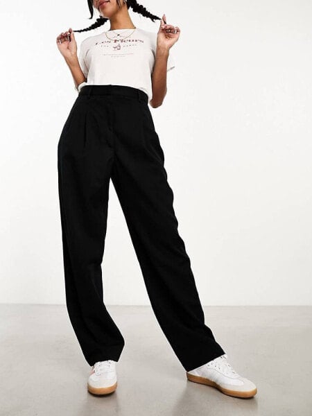 Monki tapered leg trousers with pleat front in black