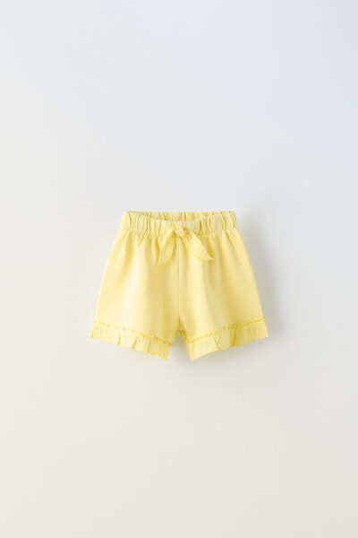 Plush bermuda shorts with bow and ruffles