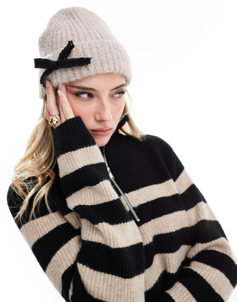 ASOS DESIGN beanie in oatmeal with black bow detail