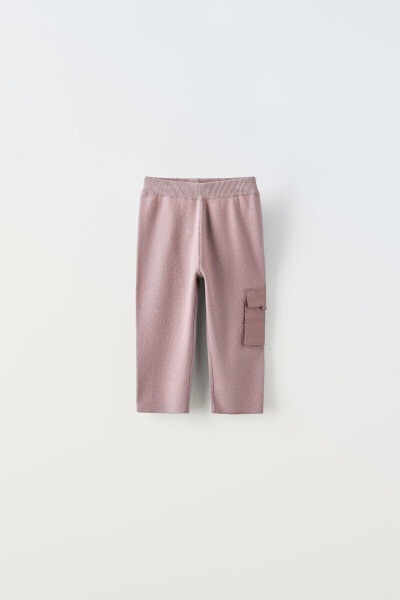 Knit trousers with contrast pocket