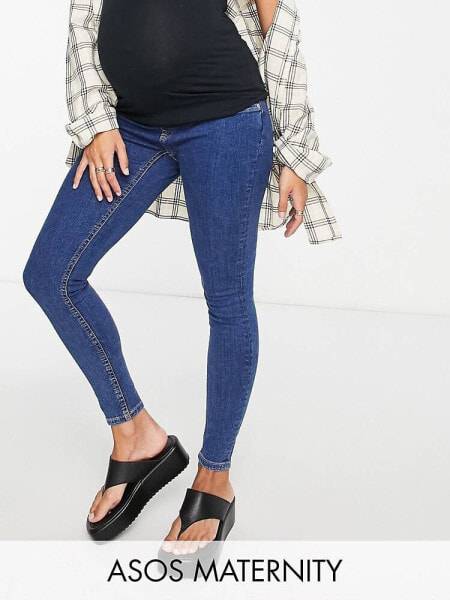 ASOS DESIGN Maternity high rise skinny jeans in mid blue with under the bump waistband