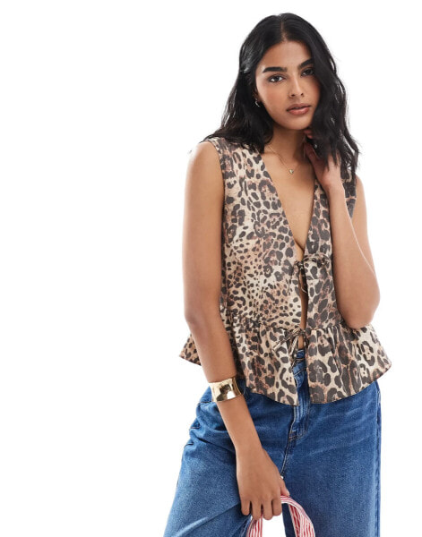 ASOS DESIGN sleeveless tie front top in animal print