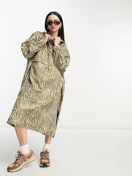 Noisy May Droplets longline rain poncho in camel zebra print