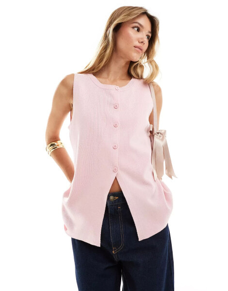 ASOS DESIGN knitted crew neck waistcoat with front split in pink