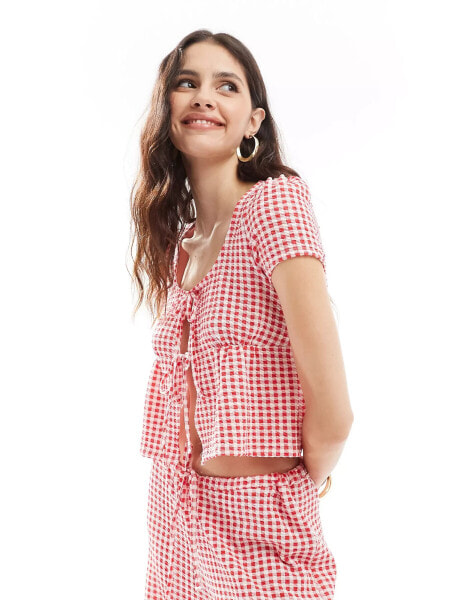 ASOS DESIGN milkmaid tie front top in red gingham print