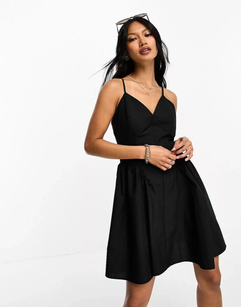 Женское мини-платье ASOS DESIGN Skater-Minikleid aus Baumwolle in Schwarz mit tief angesetzter Taille